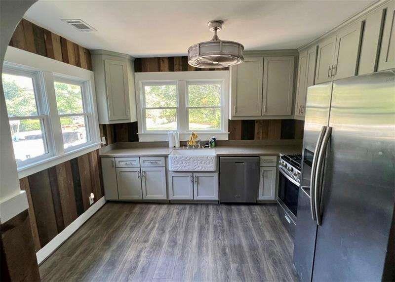 3521 Clay Road Southwest Austell, GA 30106 - Photo 2 of 13 a kitchen with a sink stove and refrigerator