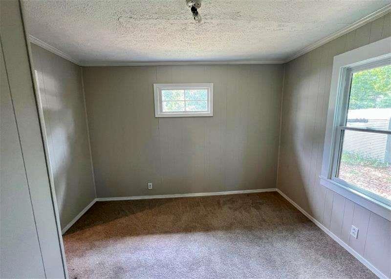 3521 Clay Road Southwest Austell, GA 30106 - Photo 7 of 13 an empty room with a window