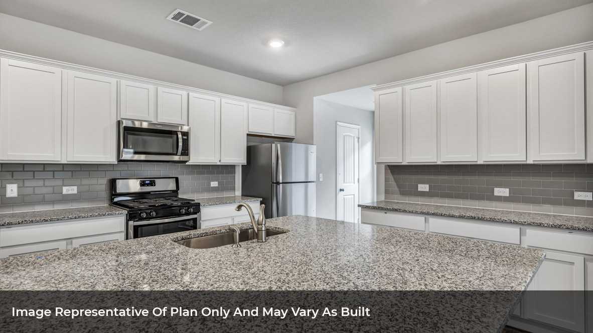 1904 Gold Dust Trail Leander, TX 78641 - Photo 11 of 21 a kitchen with appliances a sink and cabinets