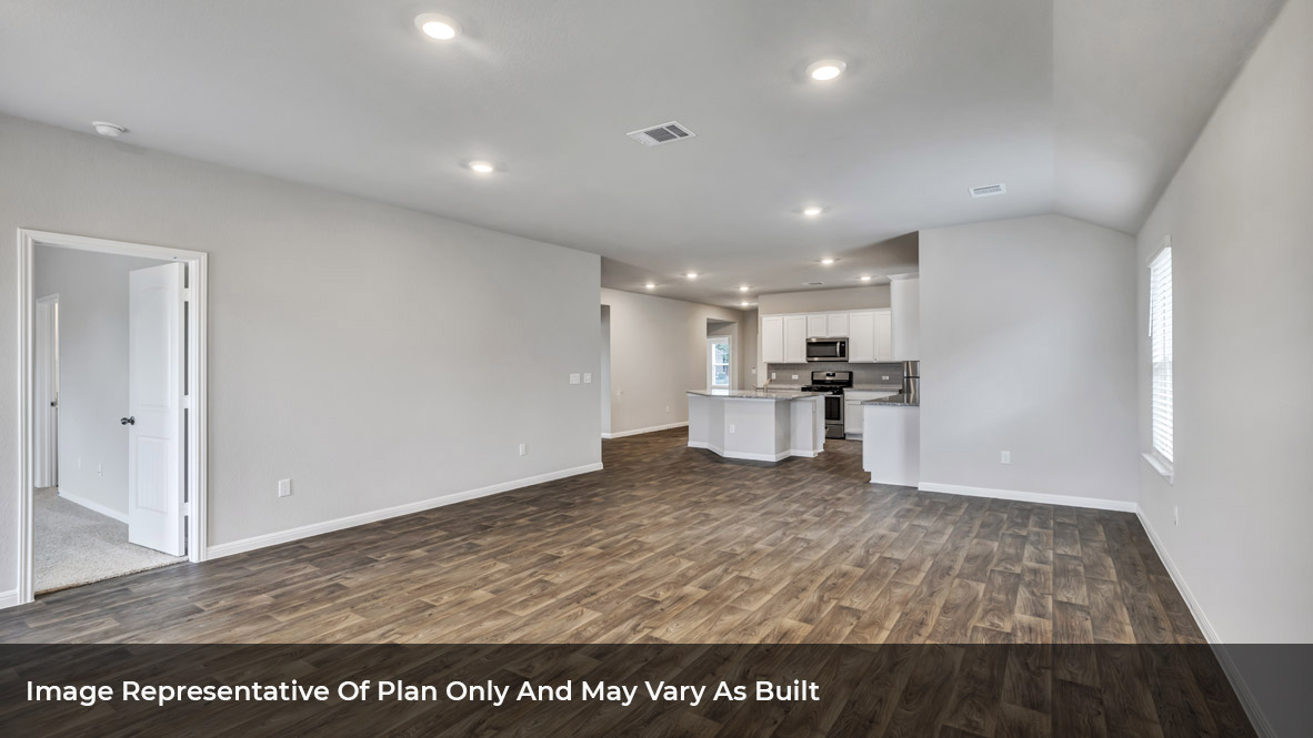 1904 Gold Dust Trail Leander, TX 78641 - Photo 16 of 21 a view of kitchen with kitchen island microwave and wooden floor