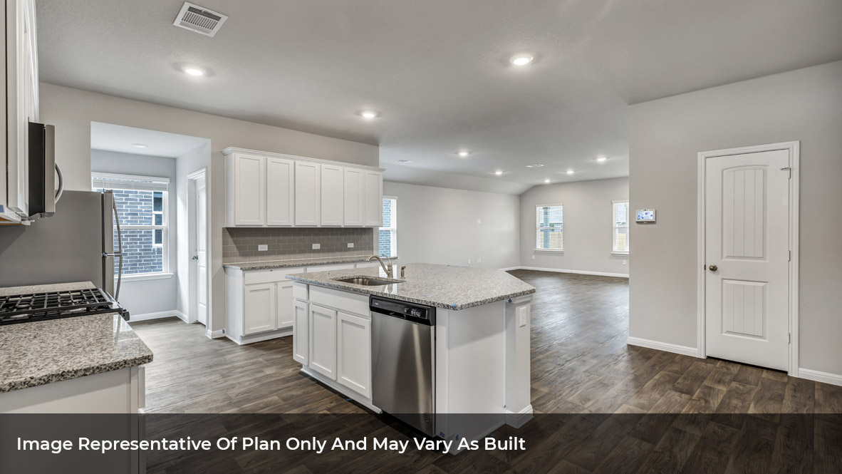 1904 Gold Dust Trail Leander, TX 78641 - Photo 9 of 21 a kitchen with stainless steel appliances granite countertop a stove a sink and a refrigerator