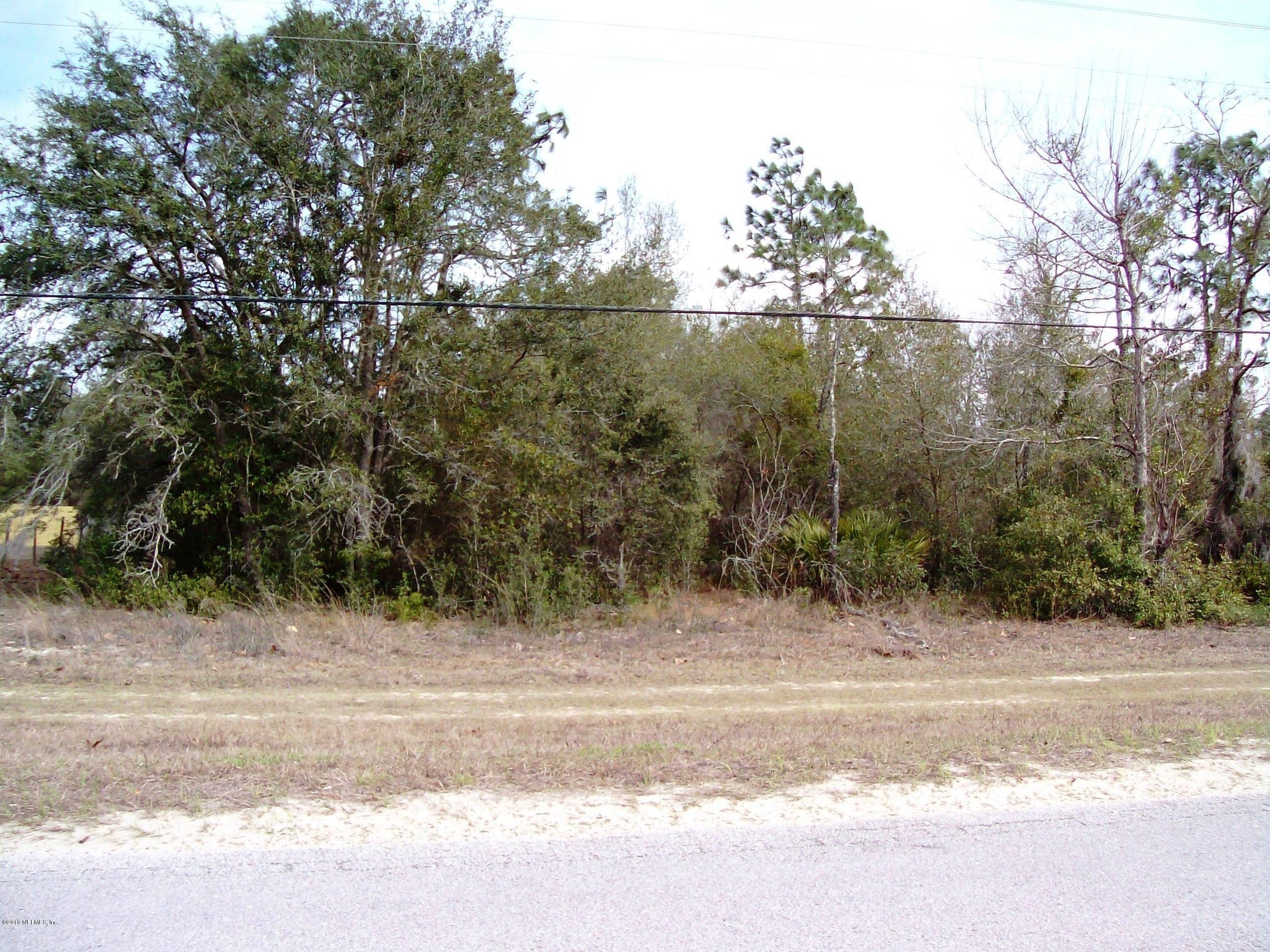 7193 Gas Line Road Keystone Heights, FL 32656 - Photo 1 of 4 a view of a yard with a barn