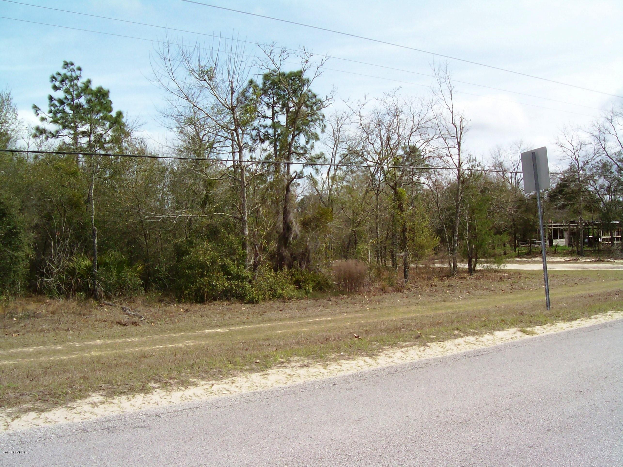 7193 Gas Line Road Keystone Heights, FL 32656 - Photo 2 of 4 a view of a house with a yard