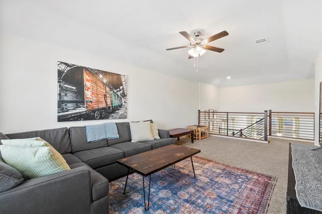 a living room with furniture and a rug