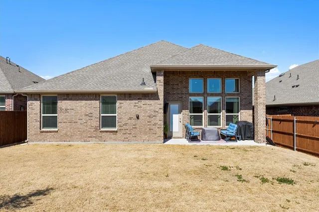 a view of a house with large windows