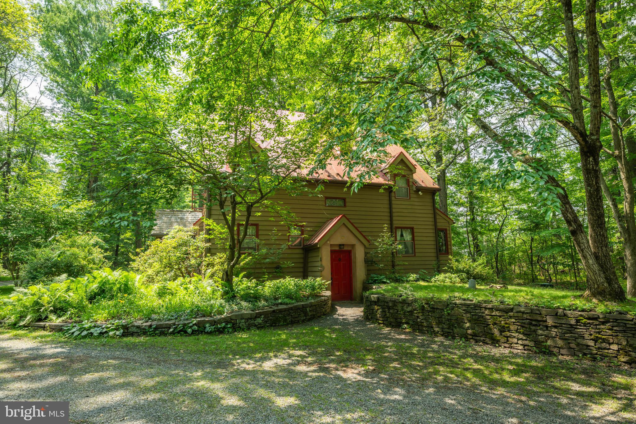 a backyard of a house with lots of green space