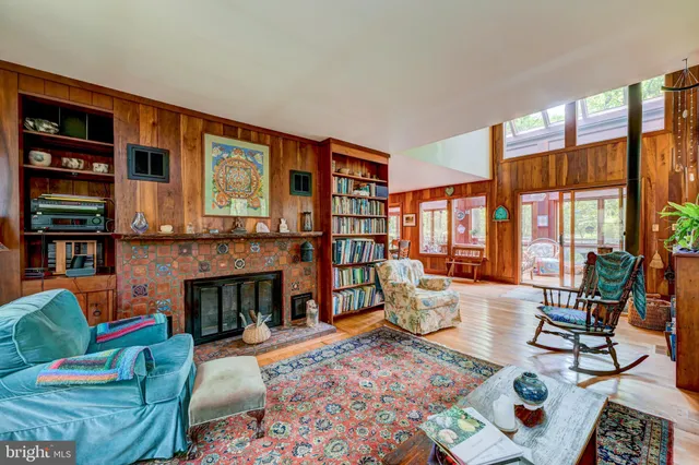 a living room with furniture fireplace and rug