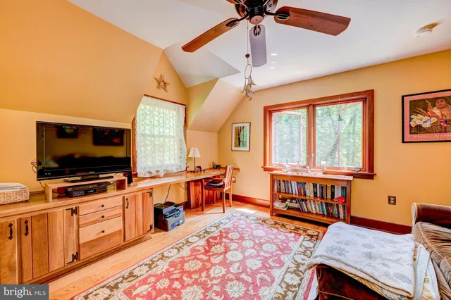 a view of a livingroom with furniture window and wooden floor