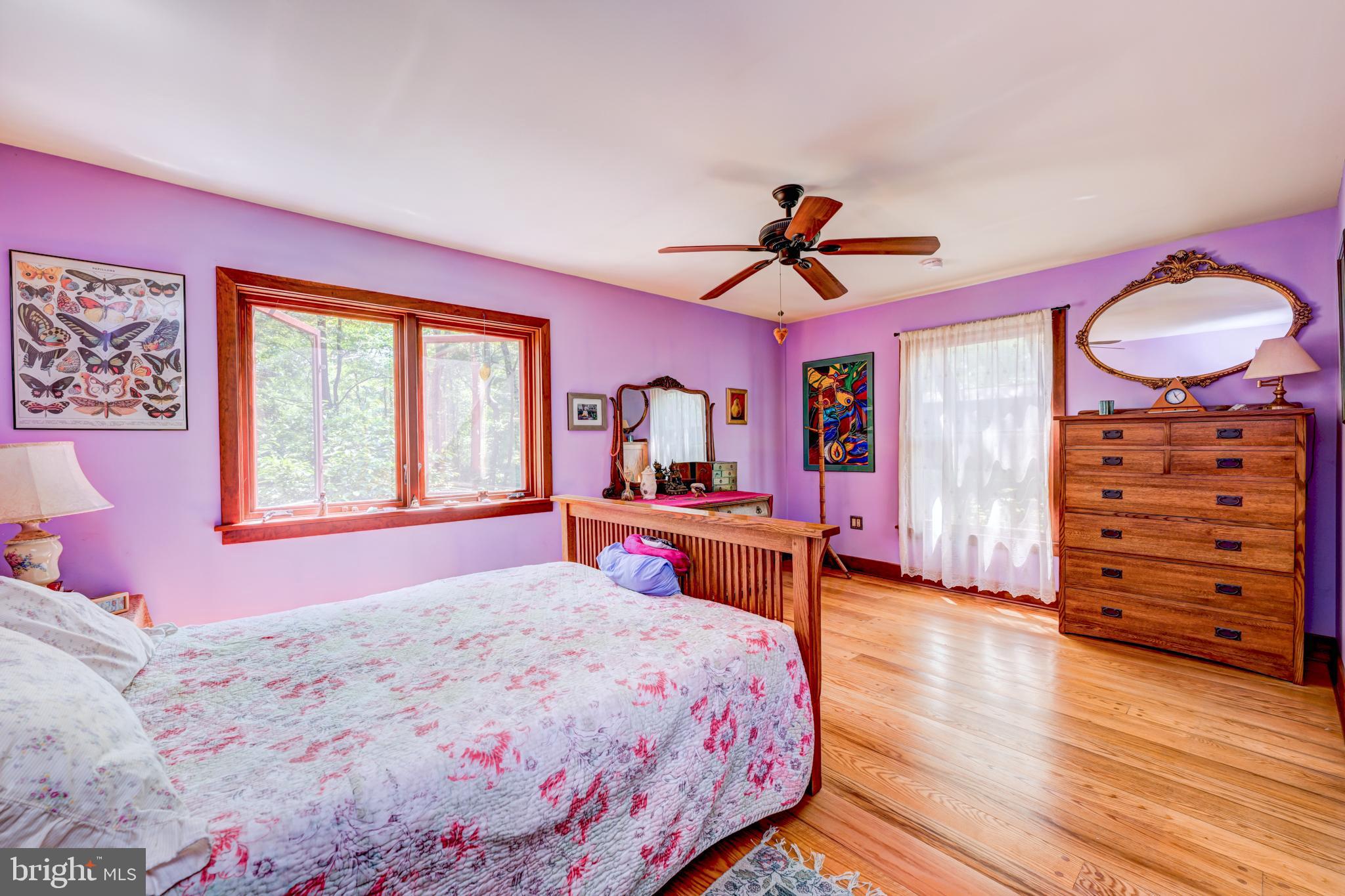 5613 Point Pleasant Pike Doylestown, PA 18902 - Photo 21 of 39 a bedroom with a bed a dresser and a window