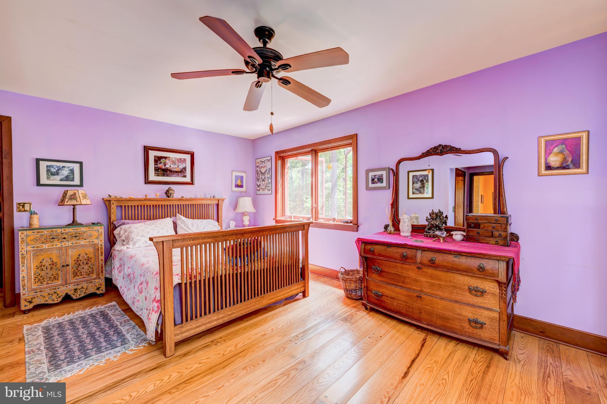 5613 Point Pleasant Pike Doylestown, PA 18902 - Photo 22 of 39 a bedroom with a bed and wooden floor