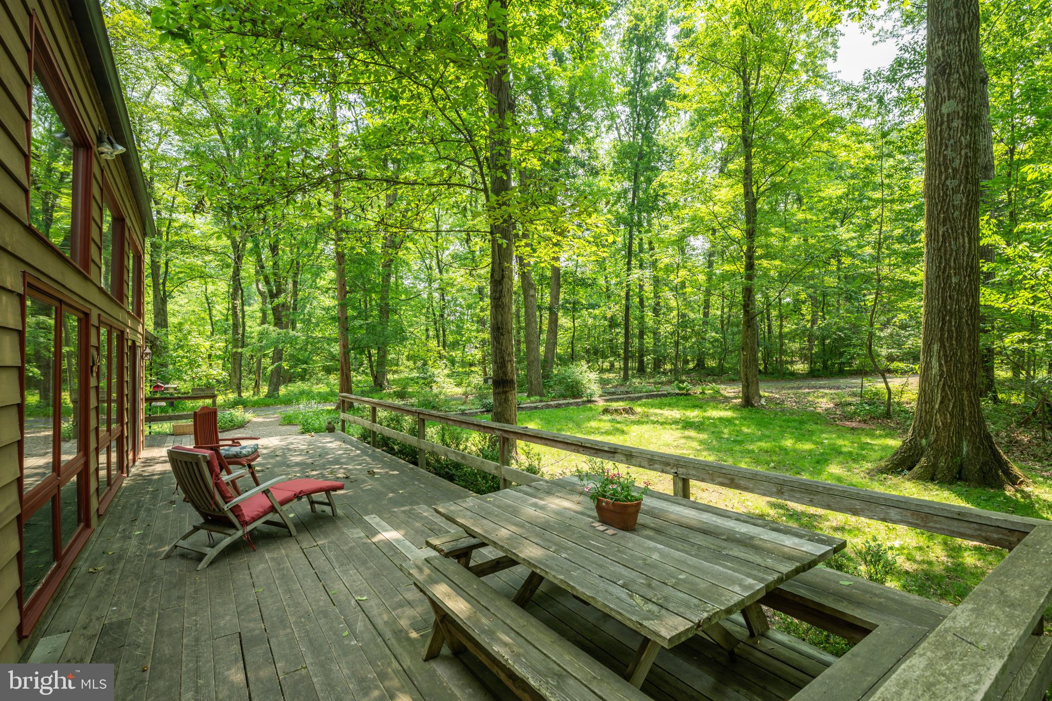 5613 Point Pleasant Pike Doylestown, PA 18902 - Photo 27 of 39 a view of a wooden deck with chairs and a yard