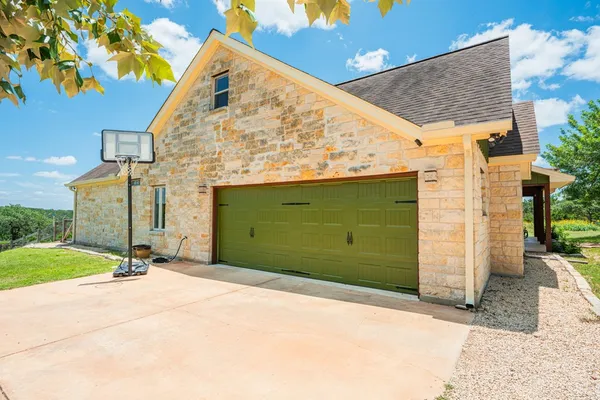 front view of a house with a tree