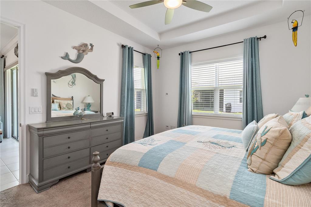 2557 Yellow Brick Road St. Cloud, FL 34772 - Photo 19 of 41 a bedroom with a bed and a mirror on dresser