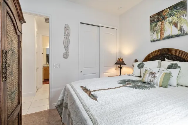 a bedroom with a bed and a mirror