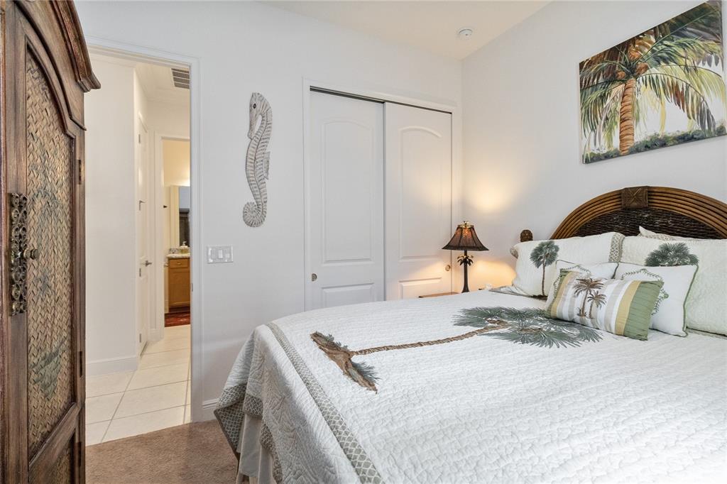 2557 Yellow Brick Road St. Cloud, FL 34772 - Photo 27 of 41 a bedroom with a bed and a mirror