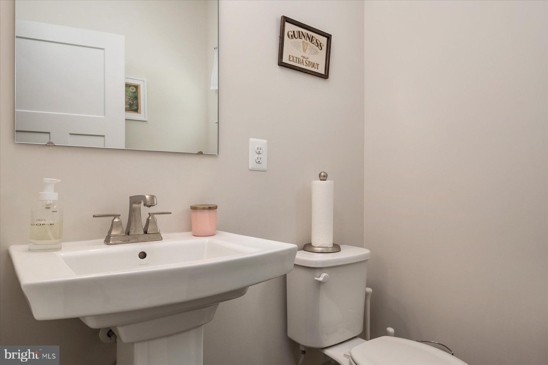 1261 Upper Patuxent Ridge Road Odenton, MD 21113 - Photo 16 of 58 a bathroom with a sink and a toilet