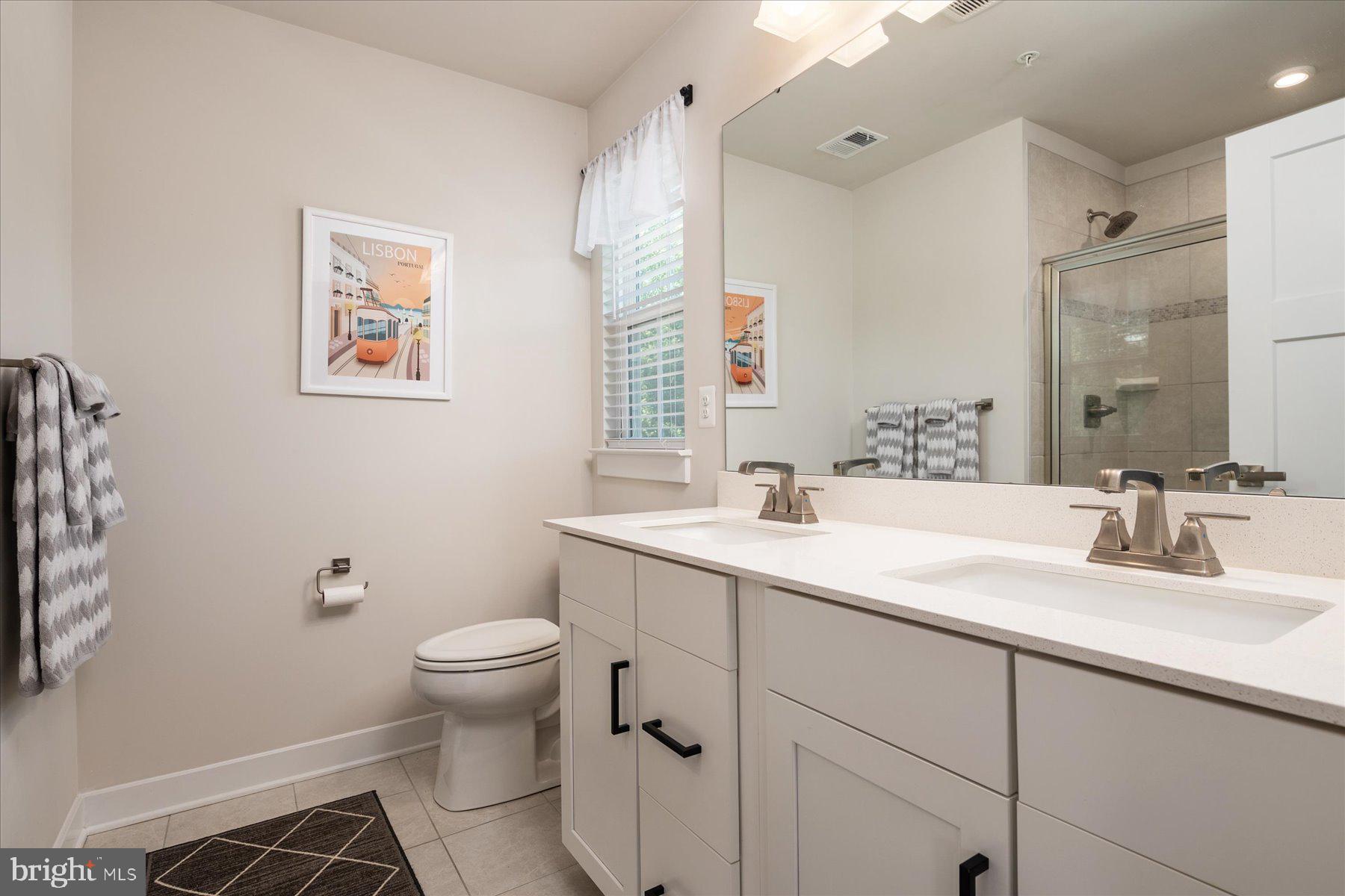 1261 Upper Patuxent Ridge Road Odenton, MD 21113 - Photo 18 of 58 a bathroom with a sink toilet and a mirror
