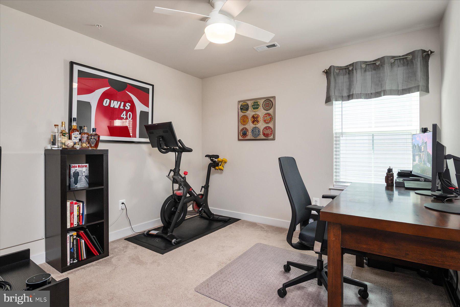 1261 Upper Patuxent Ridge Road Odenton, MD 21113 - Photo 22 of 58 a view of a workspace with furniture and a window