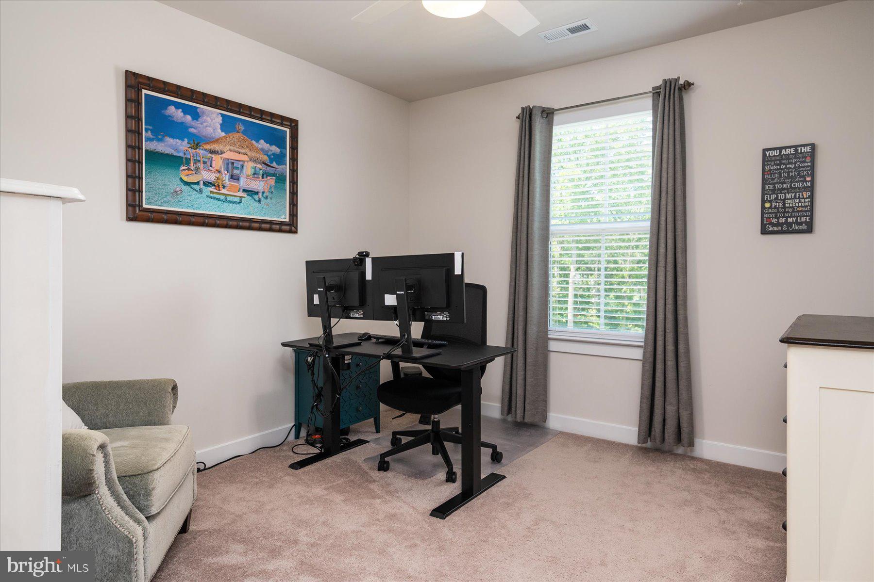 1261 Upper Patuxent Ridge Road Odenton, MD 21113 - Photo 24 of 58 a view of a workspace with furniture and a window