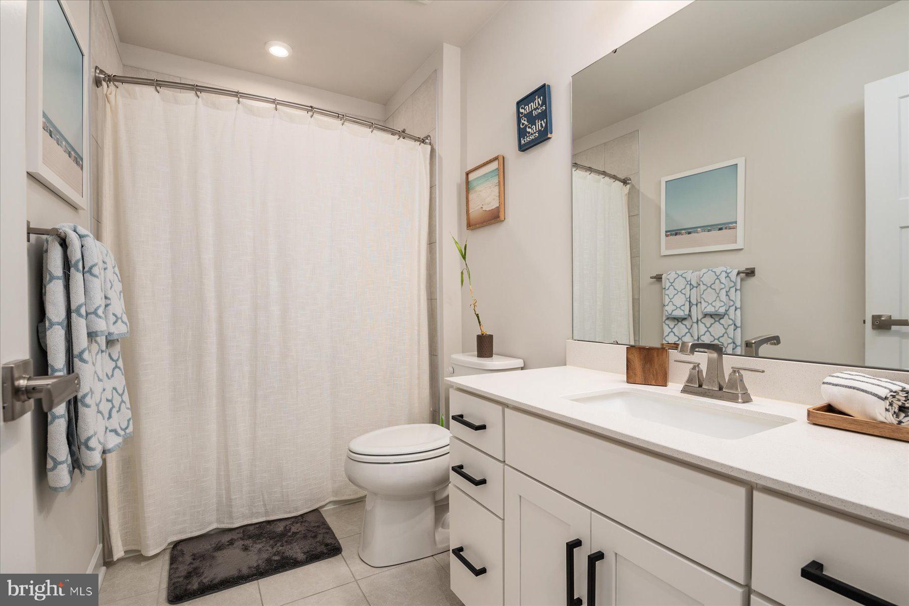 1261 Upper Patuxent Ridge Road Odenton, MD 21113 - Photo 26 of 58 a bathroom with a sink and a mirror