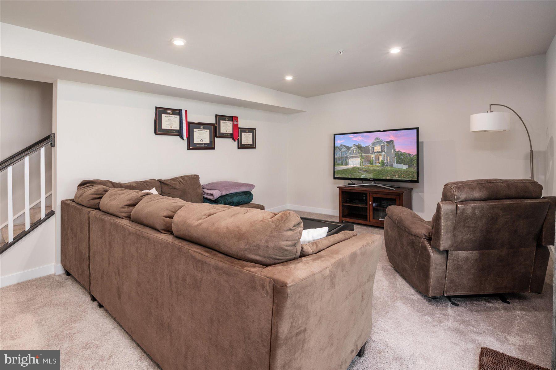 1261 Upper Patuxent Ridge Road Odenton, MD 21113 - Photo 29 of 58 a living room with furniture and a flat screen tv