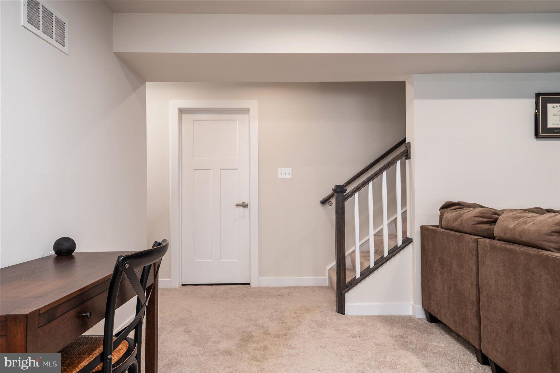 1261 Upper Patuxent Ridge Road Odenton, MD 21113 - Photo 34 of 58 a view of a livingroom with furniture and staircase
