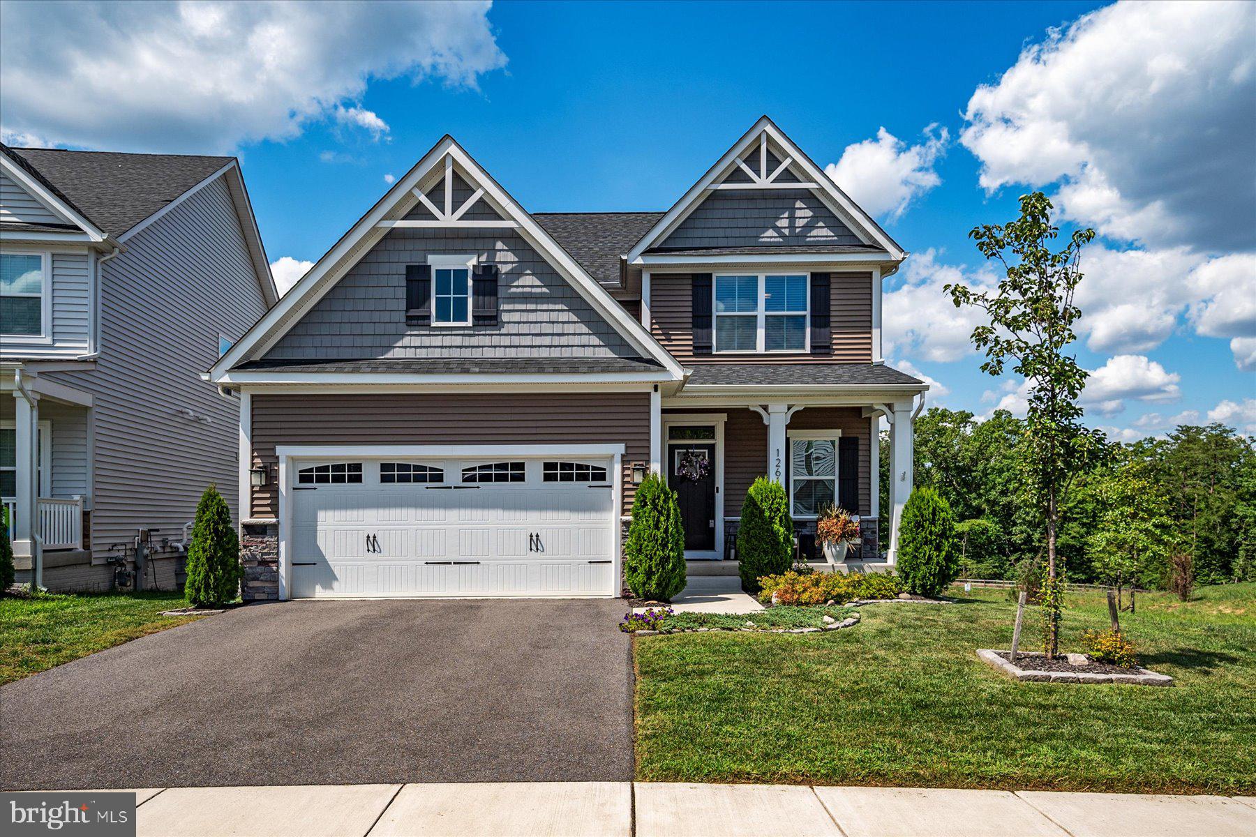 1261 Upper Patuxent Ridge Road Odenton, MD 21113 - Photo 35 of 58 a front view of a house with a yard