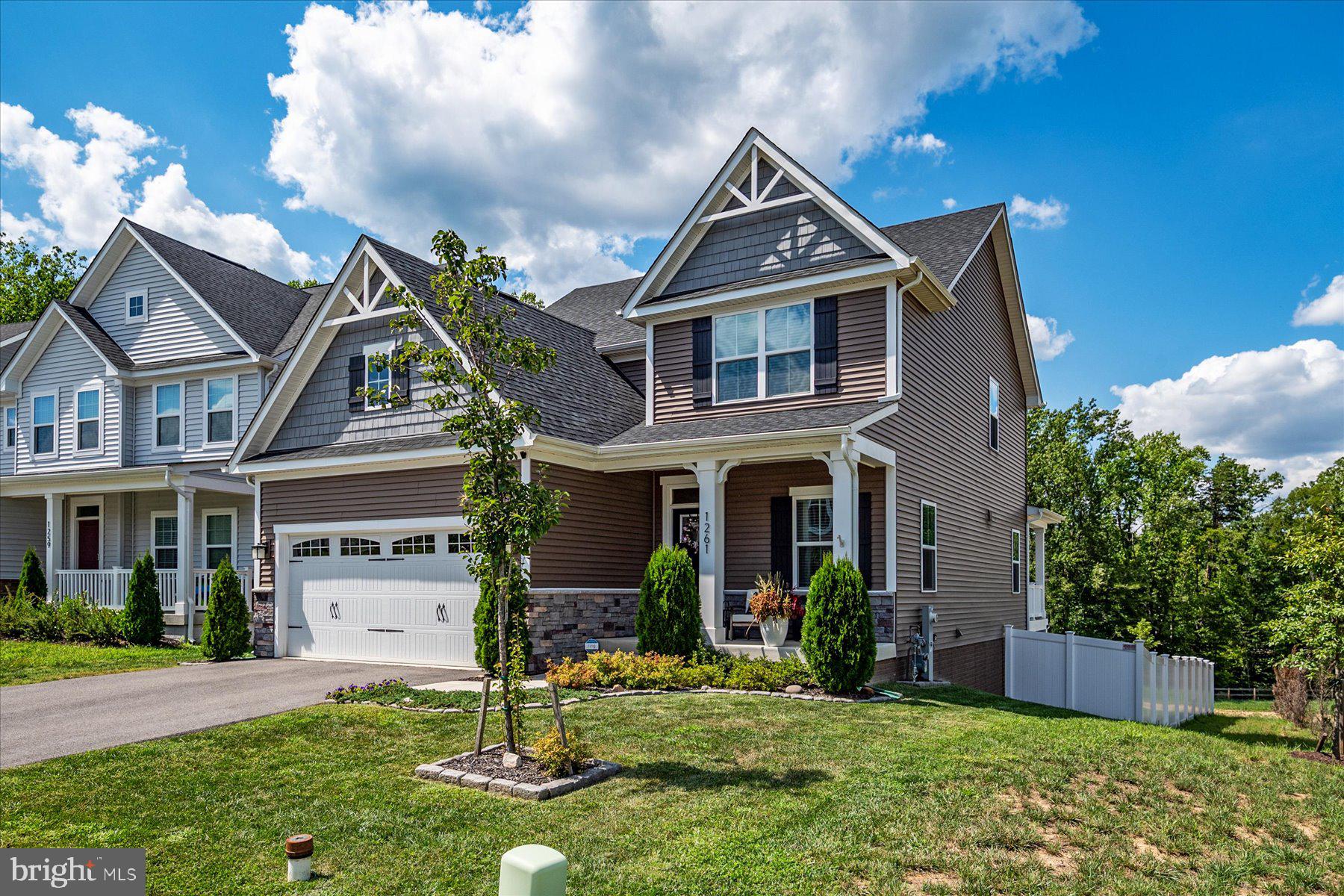 1261 Upper Patuxent Ridge Road Odenton, MD 21113 - Photo 36 of 58 a front view of a house with a yard
