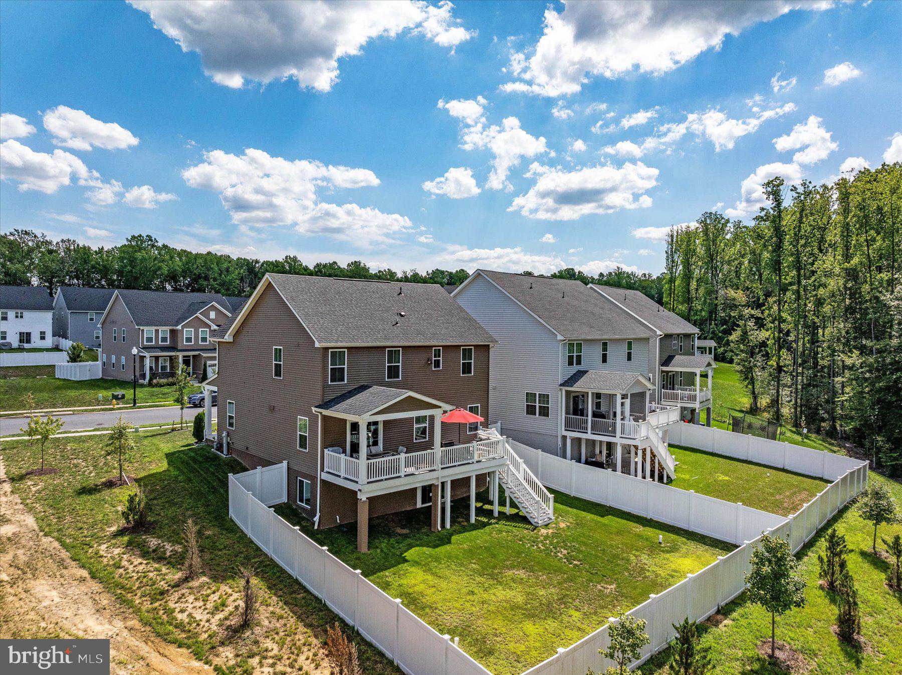 1261 Upper Patuxent Ridge Road Odenton, MD 21113 - Photo 45 of 58 a view of a house with pool view and a big yard