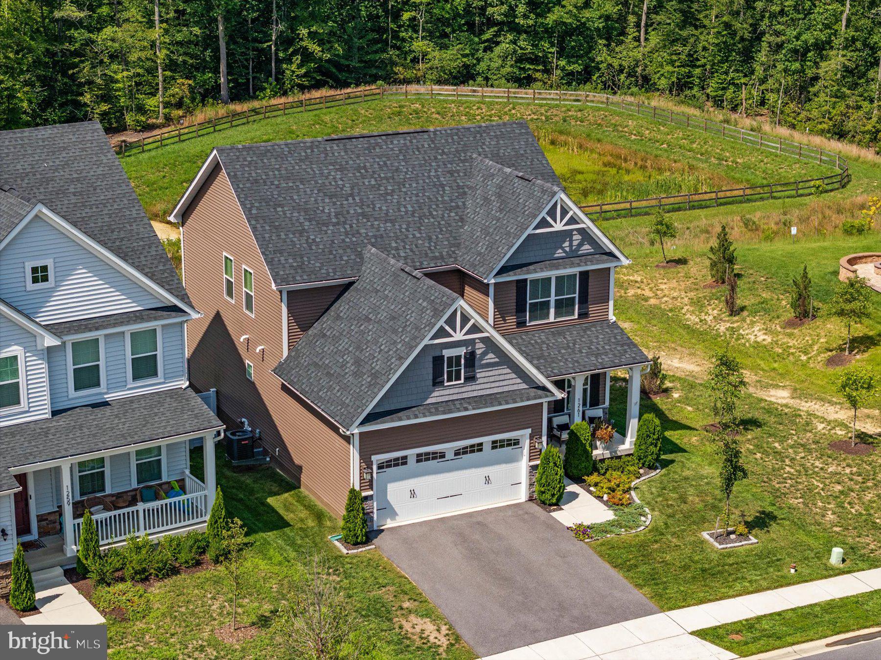 1261 Upper Patuxent Ridge Road Odenton, MD 21113 - Photo 5 of 58 a aerial view of a house with a yard