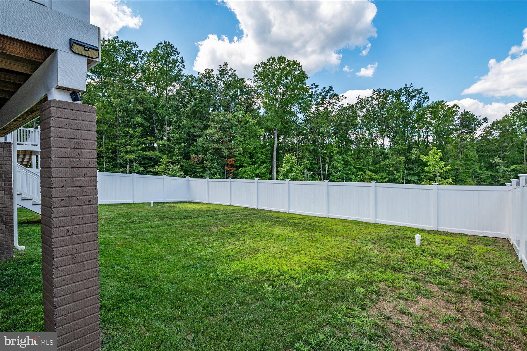 1261 Upper Patuxent Ridge Road Odenton, MD 21113 - Photo 6 of 58 a view of an outdoor space and a yard