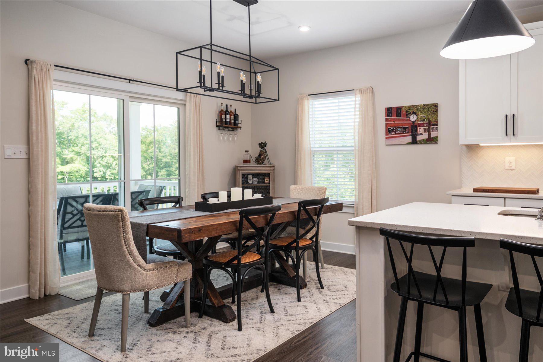 1261 Upper Patuxent Ridge Road Odenton, MD 21113 - Photo 10 of 58 a view of a dining room with furniture window and outside view