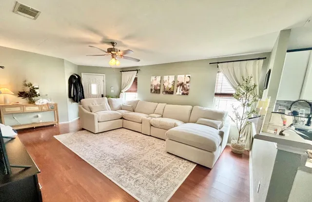 a living room with furniture and a large window
