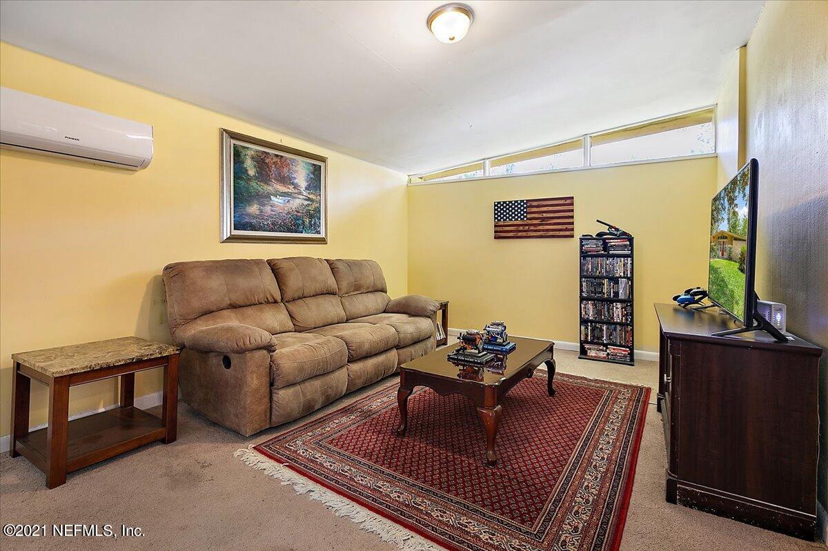 7444 Sandhurst Road South Jacksonville, FL 32277 - Photo 11 of 20 a living room with furniture and wooden floor