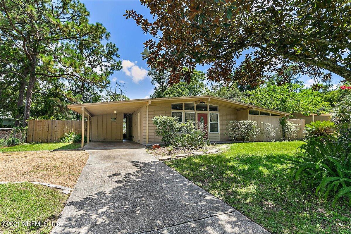 7444 Sandhurst Road South Jacksonville, FL 32277 - Photo 18 of 20 front view of a house with a yard and trees