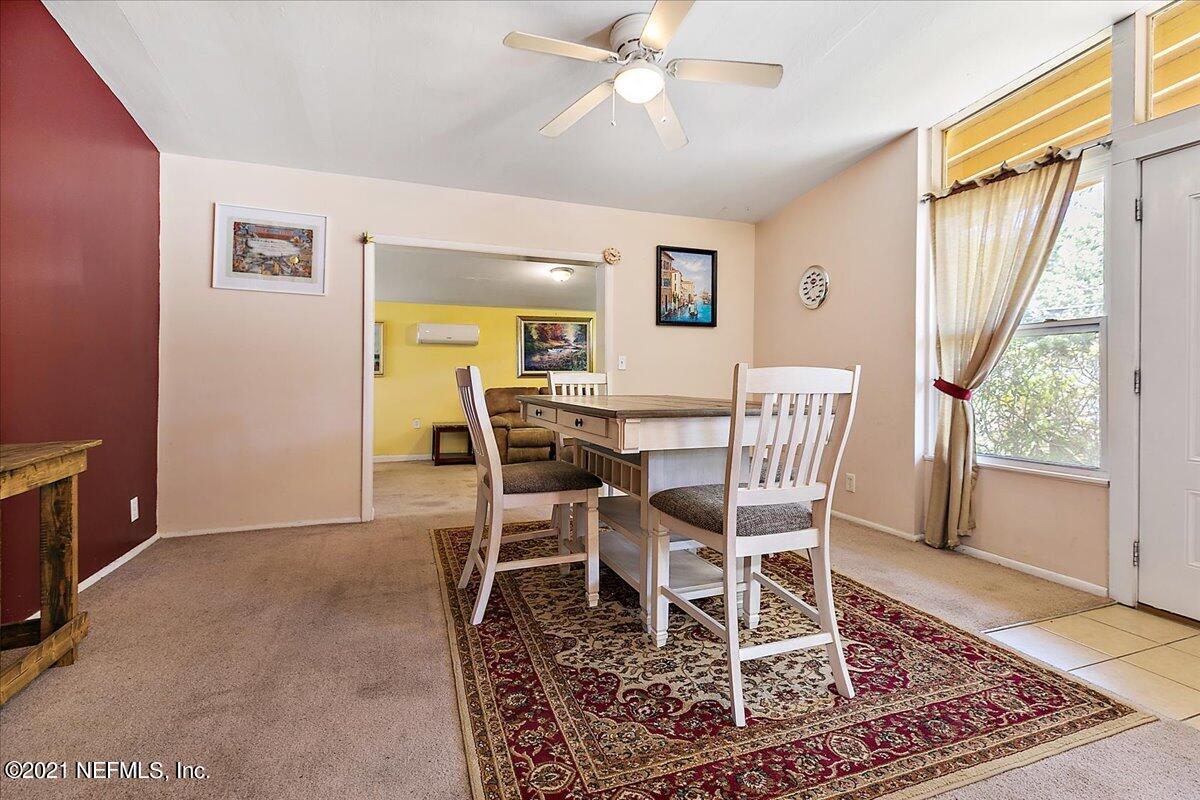 7444 Sandhurst Road South Jacksonville, FL 32277 - Photo 4 of 20 a view of a dining room with furniture and wooden floor