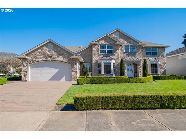 a front view of a house with a yard