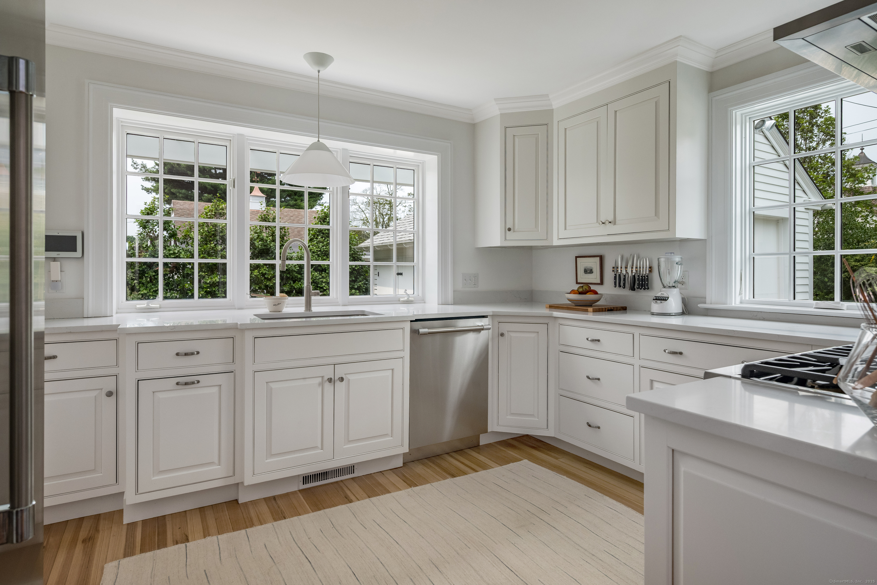 8 Lieutenant River Lane Old Lyme, CT 06371 - Photo 16 of 38 a kitchen with white cabinets and window