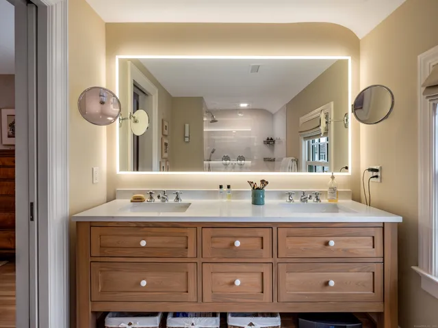 a bathroom with a sink vanity and a mirror