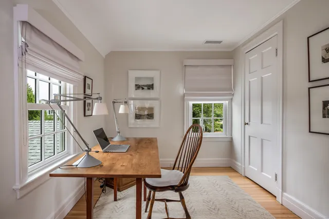 a view of a dining room with furniture window and outside view