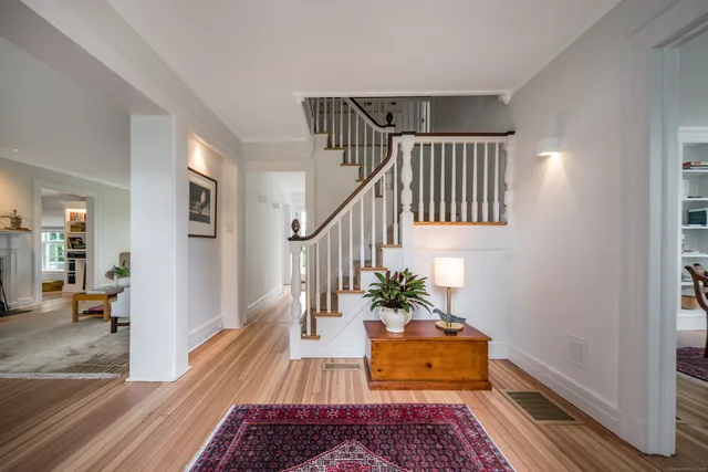 a living room with furniture and a rug