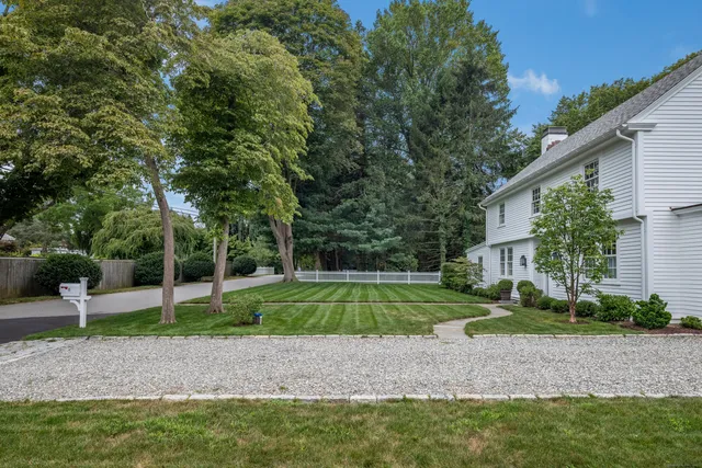 a view of a house with a backyard