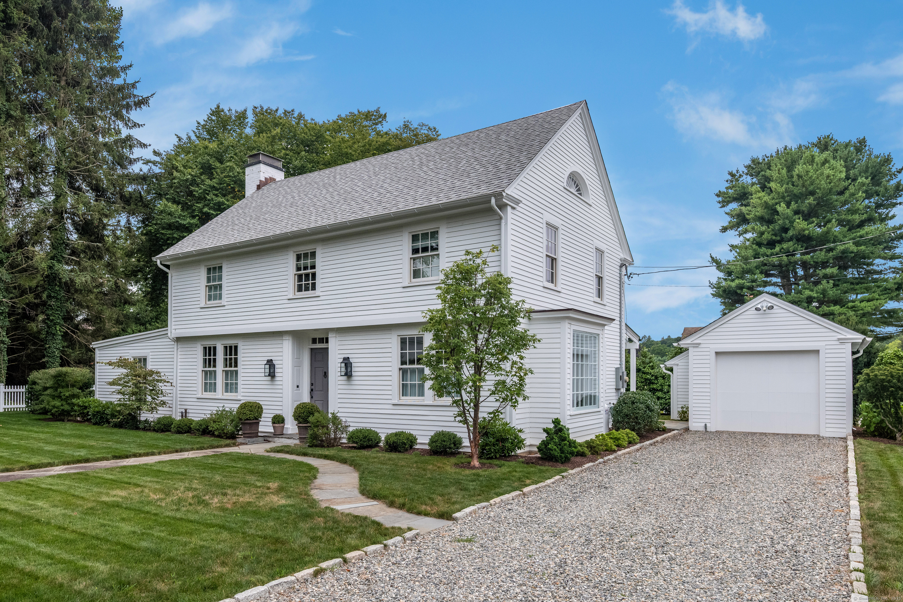 8 Lieutenant River Lane Old Lyme, CT 06371 - Photo 35 of 38 a front view of a house with a yard and garage