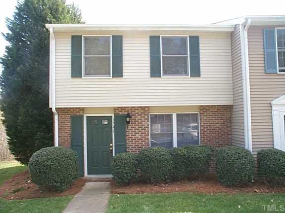 7740 Sandra Lane Raleigh, NC 27615 - Photo 1 of 1 a front view of a house with garden
