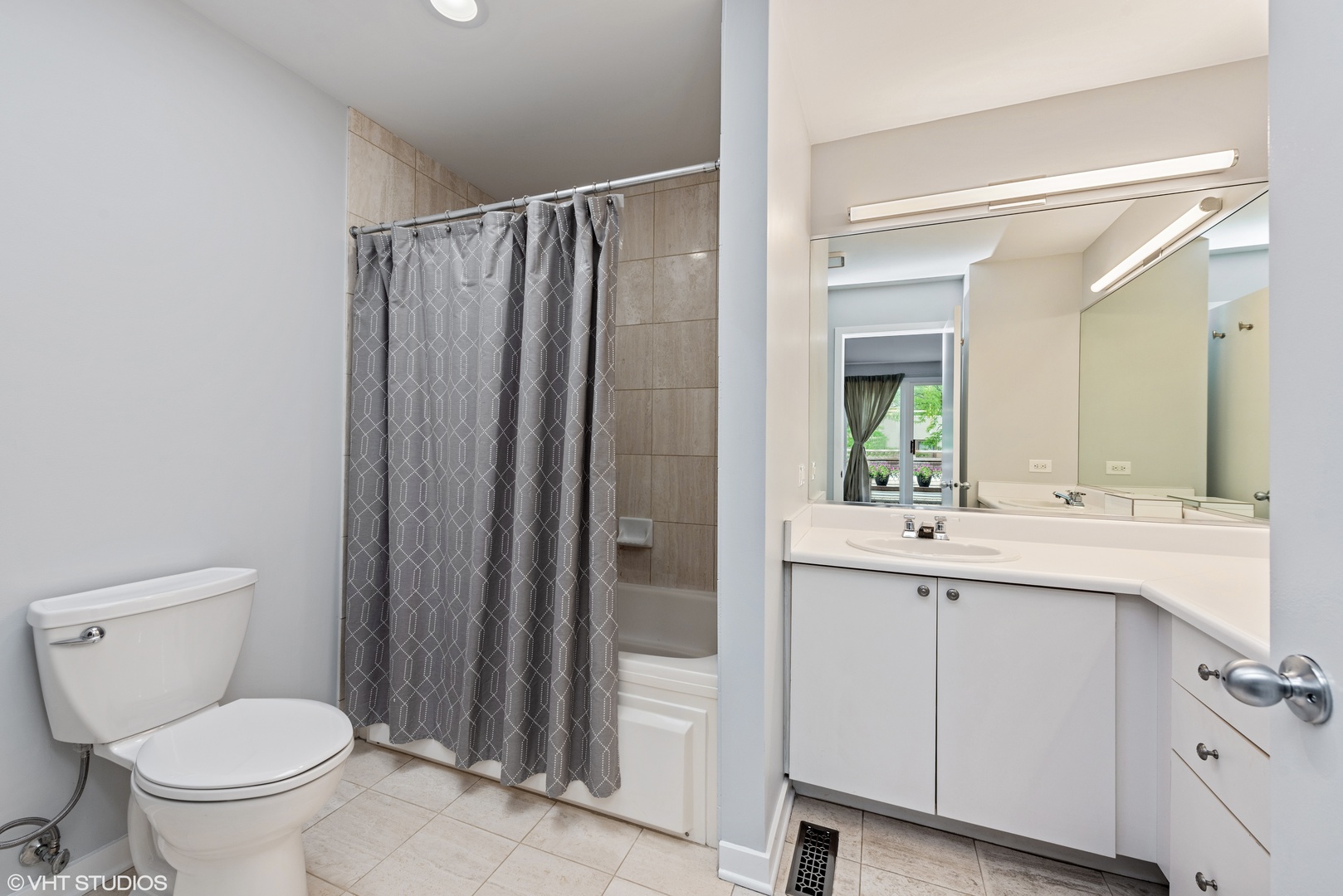 2024 North Racine Avenue, Unit M Chicago, IL 60614 - Photo 12 of 22 a bathroom with a sink a toilet and shower