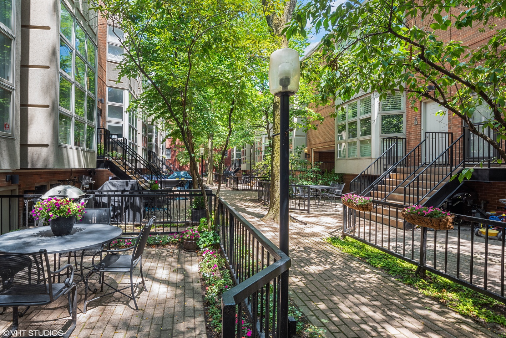 2024 North Racine Avenue, Unit M Chicago, IL 60614 - Photo 22 of 22 a view of swimming pool with chairs and table in the patio