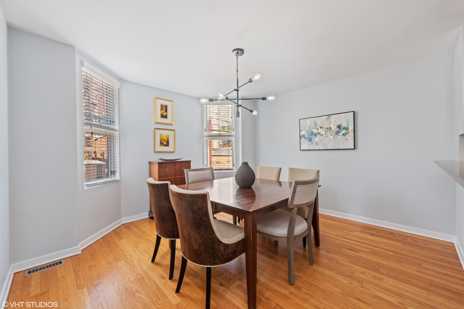 2024 North Racine Avenue, Unit M Chicago, IL 60614 - Photo 9 of 22 a view of a dining room with furniture window and wooden floor