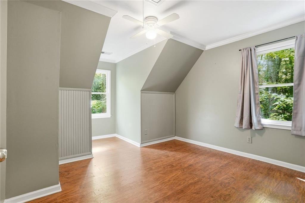 3259 Etchison Road Loganville, GA 30052 - Photo 23 of 50 a view of an empty room with wooden floor and a window