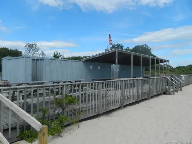 a view of balcony with wooden fence