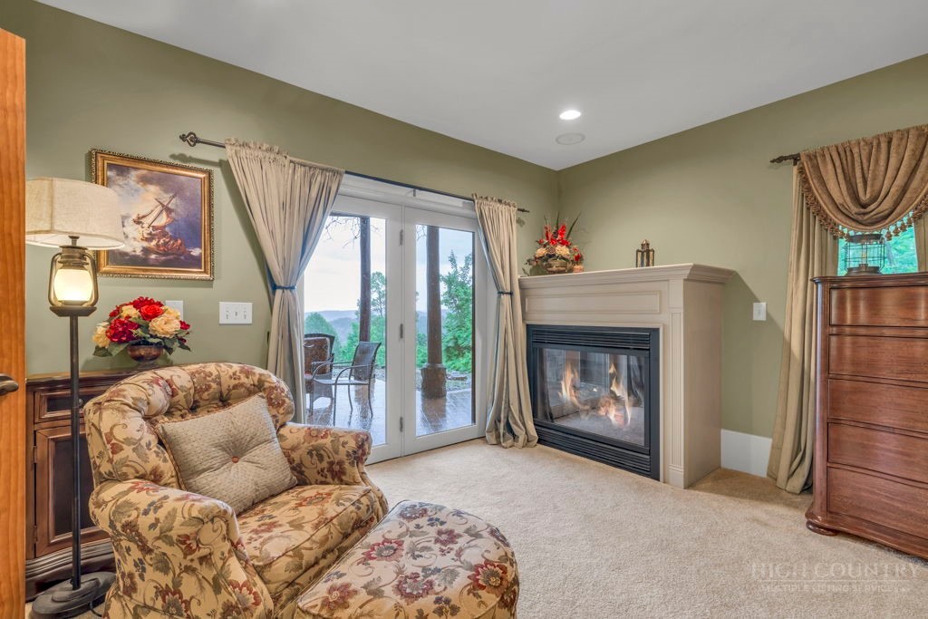 160 Outback Road Ferguson, NC 28624 - Photo 39 of 49 a living room with furniture and a fireplace